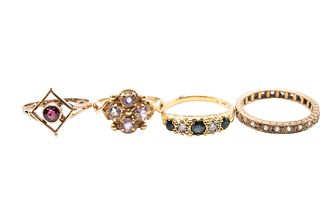 A collection of four yellow gold and gem set rings, including an 18ct ring 