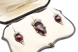 A MID 19TH CENTURY GARNET AND DIAMOND BROOCH AND EARRINGS
 The pendant set 