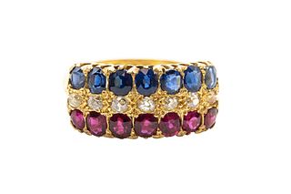 A RUBY, SAPPHIRE AND DIAMOND RING, CIRCA 1898
 Centred by a row of old bril