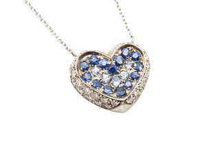 A SAPPHIRE AND DIAMOND PENDANT NECKLACE
 The heart shaped pendant pav?-set 