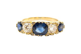 A SAPPHIRE AND DIAMOND FIVE-STONE RING
 The carved scrolling hoop claw-set 