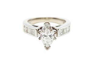 A DIAMOND RING
 The marquise-shaped diamond, weighing approximately 1.20 ca