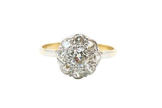 A DIAMOND CLUSTER RING
 The floraform cluster, set throughout with brillian