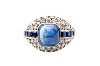 A SAPPHIRE AND DIAMOND DRESS RING
 Of bomb? design, centred by an?octagonal