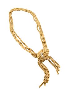 A DIAMOND-SET NECKLACE
 Of knot design, composed of three strands of spiga-