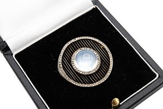 A MOONSTONE AND DIAMOND BROOCH, CIRCA 1910 
 Of circular outline, centred b
