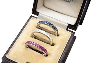 THREE GEM-SET ETERNITY RINGS
 Comprising of three channel-set bands, each r