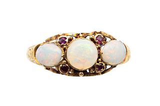 A MID 19TH CENTURY OPAL AND RUBY RING
 Set with a trio of circular and oval