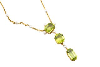 A PERIDOT AND SEED PEARL PENDANT NECKLACE
 The articulated pendant drop set
