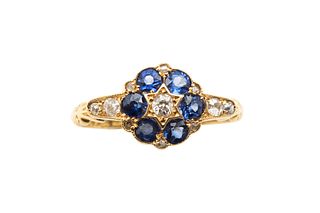 A SAPPHIRE AND DIAMOND CLUSTER RING, CIRCA 1923
 Centrally-set with an old 