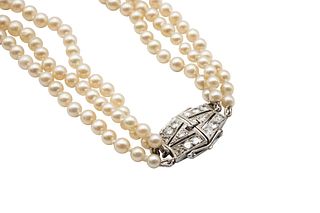 A MULTI-STRAND CULTURED PEARL NECKLACE WITH A DIAMOND CLASP
 Composed of th