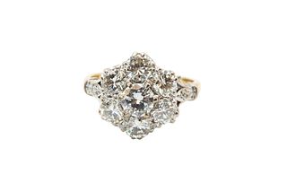 A DIAMOND CLUSTER RING
 Of floraform design, set throughout with brilliant-