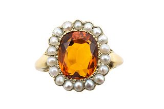 A CITRINE AND HALF PEARL RING
 The cushion-shaped citrine, within a florafo