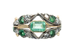 AN EMERALD AND DIAMOND RING
 The octagonal-cut emerald within an openwork s