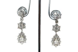 A PAIR OF DIAMOND PENDENT EARRINGS
 Each composed of a duo of brilliant-cut