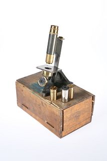 A LACQUERED BRASS MICROSCOPE, BY R & J BECK, LONDON, no. 29915, with lenses