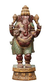 A CARVED AND PAINTED WOODEN FIGURE OF GANESH, probably 19th Century. 43.5cm
