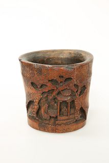 A CHINESE CARVED BAMBOO BRUSH POT, decorated in relief with figures under t