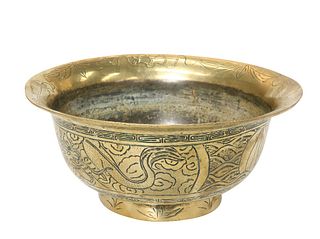 A LARGE CHINESE BRASS BOWL, chased with ferocious dragons and scrolling clo