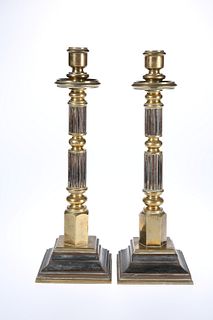 A SUBSTANTIAL PAIR OF BRONZE CANDLESTICKS, 19th Century, with reeded and kn