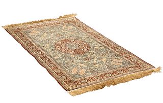 AN INDIAN SILK RUG, with shaped circular roundel to the centre. 168cm by 95