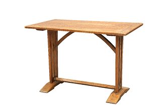 AN ARTS AND CRAFTS ELM TAVERN TABLE, the cleated rectangular top raised on 