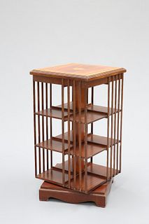 AN INLAID MAHOGANY REVOLVING BOOKCASE, the satinwood banded and strung top 