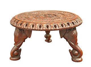 A BURMESE CARVED HARDWOOD STAND,?the circular top with pierced edge, carved