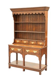 A SMALL OAK DRESSER AND RACK, IN GEORGIAN STYLE, the boarded rack with penn