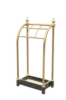 A VICTORIAN BRASS STICKSTAND, with urn-topped uprights and six compartments