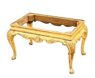 A CHIPPENDALE STYLE GILTWOOD STOOL, rectangular, raised on leaf carved cabr