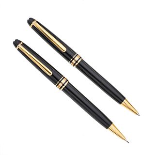 Bolígrafo y lapicero Montblanc. Cuerpo en resina color negro. Clip acero dorado. Estuche no original.