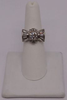 JEWELRY. Platinum and Diamond Bow Form Ring.