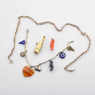 COLLECTION OF YELLOW GOLD JEWELRY AND CHARMS