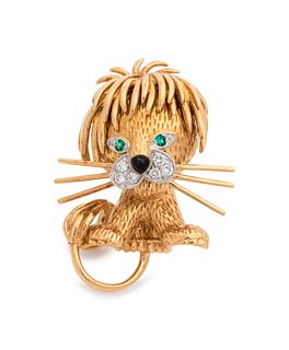 VAN CLEEF & ARPELS, YELLOW GOLD, DIAMOND AND EMERALD LION BROOCH