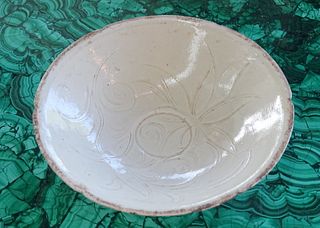 A Chinese White Glazed Molded Flower Bowl