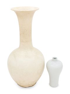 Two White Glazed Anhua Decorated VasesHeight of taller 17 in., 43.2 cm.