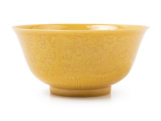 An Incised Yellow Glazed Porcelain 'Dragon and Phoenix' BowlDiam 5 1/2 in., 13.97 cm.