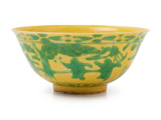 An Incised and Green Enameled Yellow Ground 'Boys' Porcelain BowlDiam 6 in., 15.2 cm.