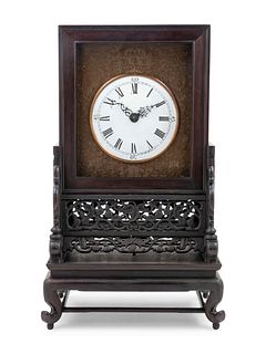 A Hardwood Mantel Clock
Height overall 25 1/4 in., 64 cm.