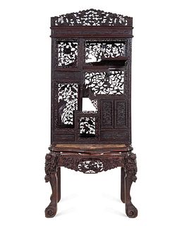 A Chinese Export Carved Hardwood Displaying Cabinet and DeskHeight overall 86 x width 35 1/2 x depth 25 in., 218 x 90 x 63.5 cm. 