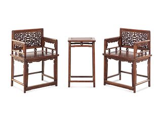 A Pair of Huali Low-Backed Armchairs and Matching Stand TableHeight of chairs 34 1/2 x width 24 x depth 18 1/2 in., 87.6 x 60.9 x 47 cm.