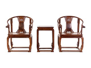 A Set of Two Huanghuali Armchairs and One Side Table Height of chair 40 x width 26 1/2 x depth 21 in., 101.6 x 67.3 x 53.3 cm.