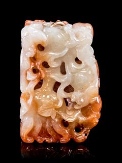 A Chinese Russet Jadeite Reticulated PendantLength 1 3/4 in., 4 cm.