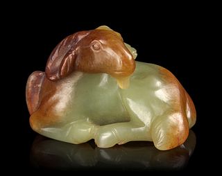 A Russet and White Jade Figure of a Ram
Length 2 3/4 in., 6.9 cm.