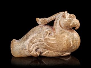 A Calcified Jade Figure of a Phoenix
Length 2 1/2 in., 6.3 cm.