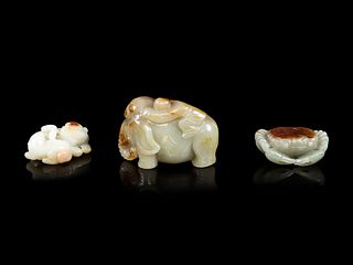 Three Chinese Jade Celadon and Russet FiguresLength of longest 3 in., 7.6 cm.