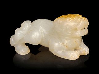 A Russet and White Jade Figure of a Recumbent Beast
Length 2 1/4 in., 5.7 cm. 