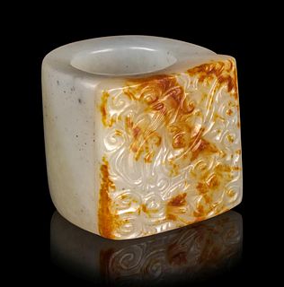 A Russet and White Jade Archer's Ring
Diam interior 7/8 in., 2.2 cm.