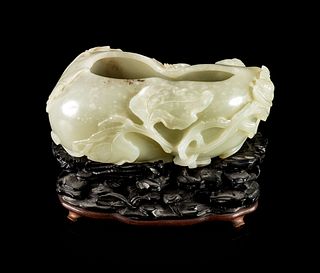 A Celadon Jade Gourd-Form Brush Washer
Length 5 in., 12.7 cm.